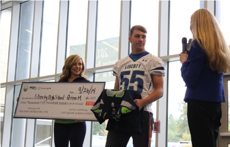 Liberty scholar-athlete receives raucous recognition