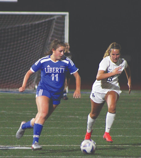 Ashley Kirschner (12) runs down the field to score her second goal of the game.
