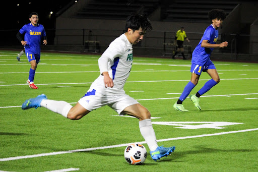 Go for the goal: Senior Ethan Lu takes a shot at the boys’ varsity soccer game on April 5th, at which Liberty beat the Hazen Highlanders 1-0.
